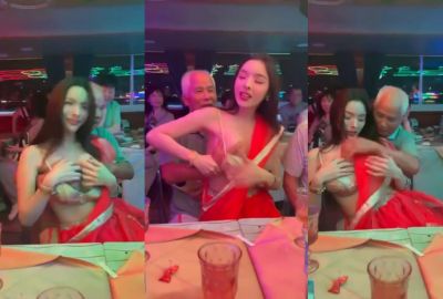 gathering old man squeezes a whore’s boobs at a public An